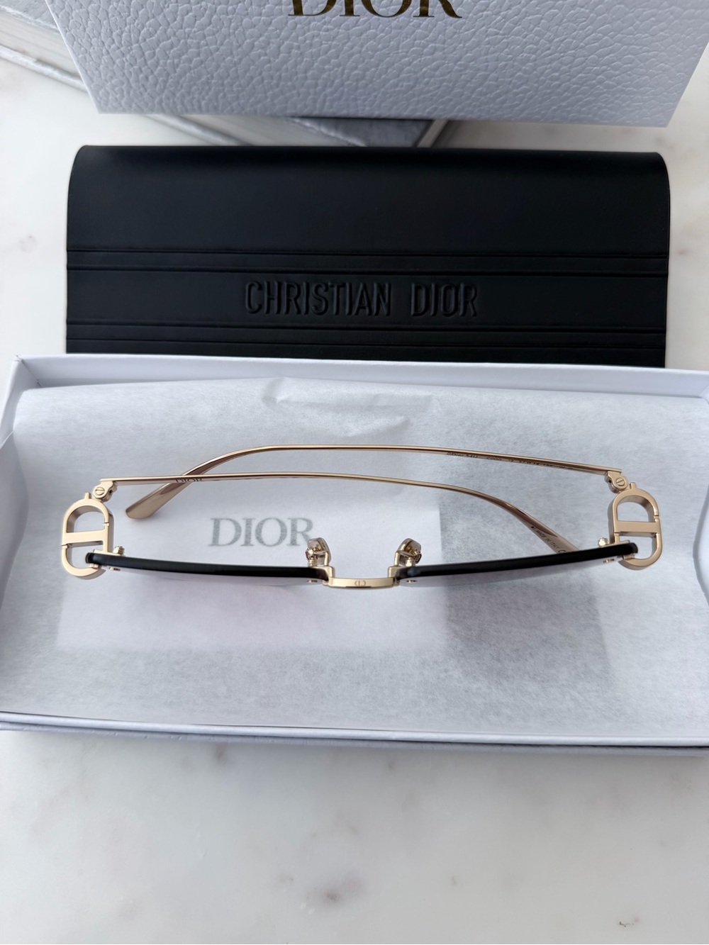 Dior Rimless Sunglasses with Pinkish-Purple Tinted Lenses and Gold Accents - Picture 2 of 4